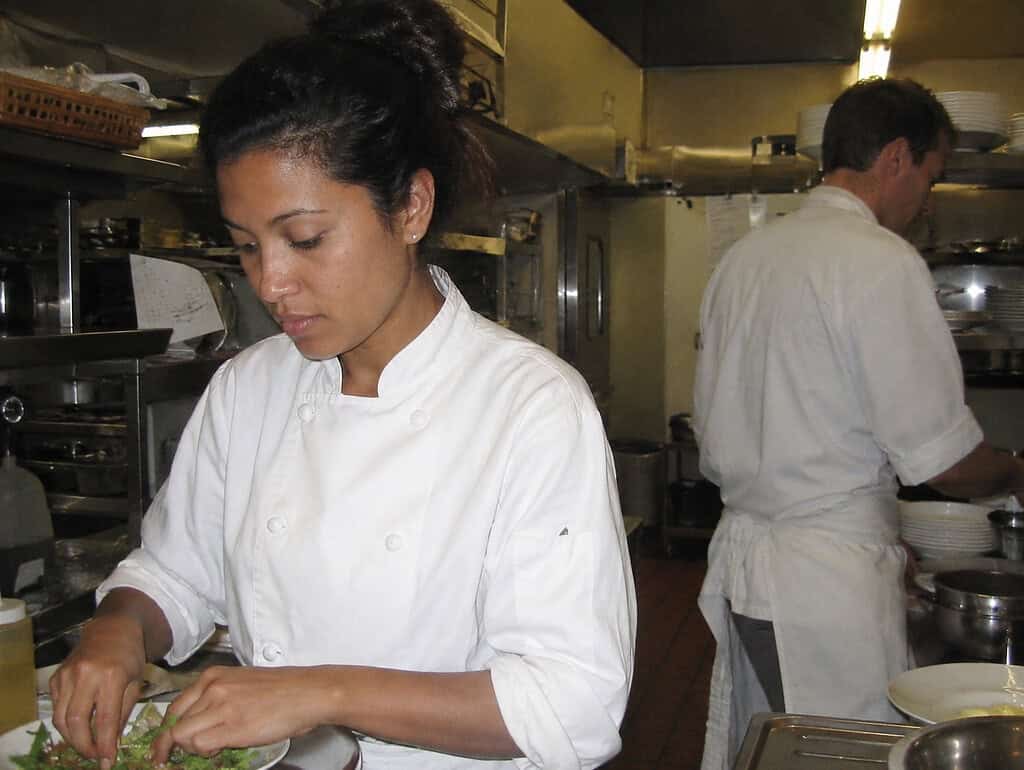 Karen Nouse preparing food in a busy restaurant kitchen